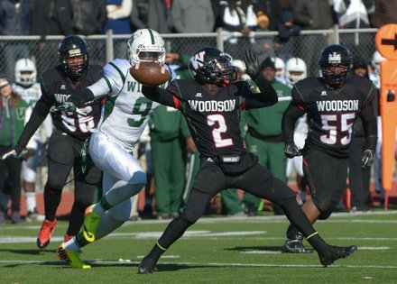 H.D. Woodson quarterback Rashad Cooper prepares to throw deep during the 44th Annual Turkey Bowl, a Thanksgiving tradition, in Southeast on Thursday, Nov. 28. H.D. Woodson defeated Wilson, 25-13.