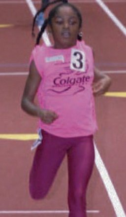 Preteen elementary school girls competing at the Armory track