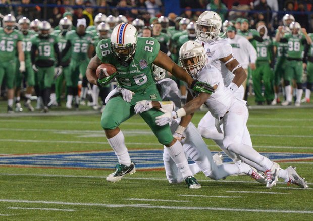 Marshall tight end Gator Hoskins barrels through Maryland defenders in the 2013 Military Bowl on Friday, Dec. 27 at Jack Stephens Field at Navy-Marine Corps Memorial Stadium in Annapolis. The Thundering Herd defeated the Terrapins, 31-20.