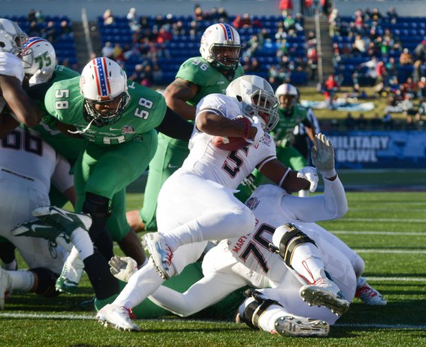 Maryland Terrapins running back Albert Reid looks for room as he tries to get out of the end zone after a well-placed kick by the Marshall Thundering Herd deep into the Terrapins territory in the first half of the 2013 Military Bowl on Friday, Dec. 27 at Jack Stephens Field at Navy-Marine Corps Memorial Stadium in Annapolis. Marshall defeated Maryland, 31-20.