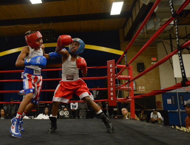 Kesean Bagwell (left) readies a left hook against Lawrence Malcolm in the first round of a three-round bout at the District Heights Classic, an annual amateur boxing event, at the District Heights Municipal Center on Saturday, Jan. 4. Bagwell won the fight by decision.