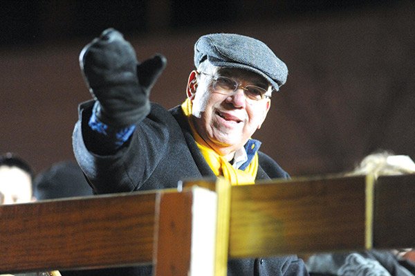 Mayor Thomas M. Menino greets the crowds along Boylston Street that were gathered to see the 2014 First Night procession. Menino’s final term in office ended Monday.
