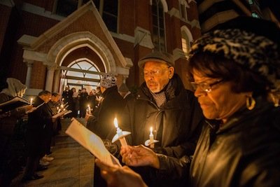 Bob Bates and Delores Short participate in a candlelight vigil outside of the Metropolitan A.M.E. Church in Northwest D.C. after the National Youth Day of Action Against Gun Violence summit sponsored by National Action Network on Wednesday, Jan. 8.