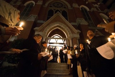 People gather for a candlelight vigil outside the Metropolitan A.M.E. Church in Northwest D.C. after the National Action Network-sponsored National Youth Day of Action Against Gun Violence summit on Wednesday, Jan. 8.