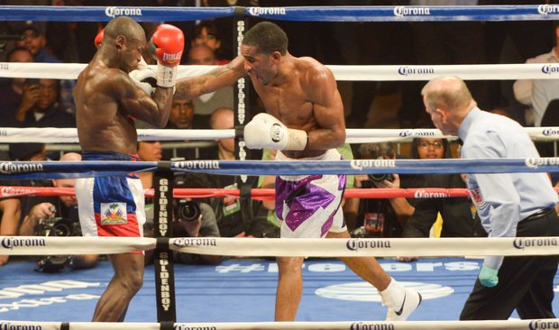 Junior welterweight champion Lamont Peterson lands a solid right jab against Dierry Jean in the eighth round on Saturday, January 25 at the D.C. Armory with over 5,550 in attendance. Peterson won the 12 round bout by way of decision.