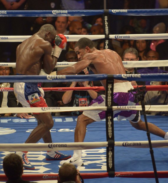 Junior welterweight champion Lamont Peterson lands a solid body punch in the 12th round on Saturday, January 25 at the D.C. Armory with over 5,550 in attendance. Peterson won the 12 round bout by way of decision.