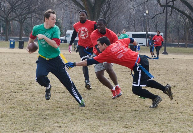 Chad B. eludes Steve Lanier during a flag football game on the National Mall in D.C. on Sunday, Feb. 2. The NAKID Winter Football League plays on the Mall on the weekends.