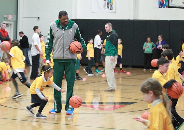 Boston Celtic Assistant Coach Walter McCarty works with kids at a special nutrition and fitness community event designed to show 150 area youth and adult participants how they can incorporate healthy eating and physical fitness into their daily routine.