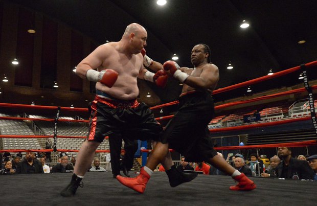 Nick Cyr (left) faces Alando Pugh in a match at the D.C. Armory on Friday, Feb. 7. Pugh won by knockout.