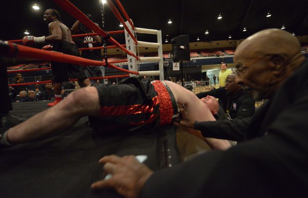 Alando Pugh knocks Nick Cyr out of the ring during their match at the D.C. Armory on Friday, Feb. 7. Pugh won by knockout.