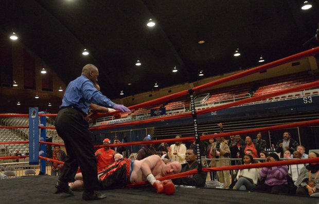 Alando Pugh knocks Nick Cyr out of the ring during their match at the D.C. Armory on Friday, Feb. 7. Pugh won by knockout.