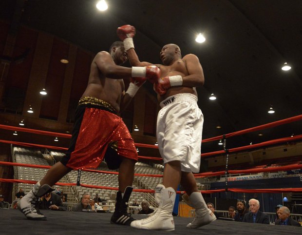 Franklin Edmondson (right) throws an uppercut against Zakki Scott on Friday, Feb. 7 during a bout at the D.C. Armory. Scott won by unanimous decision.
