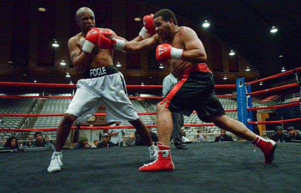 Willis "The Prophet" Lockett (black trunks) faces Julius Fogle in a six-round bout at the D.C. Armory on Friday, Feb. 7. Lockett won by unanimous decision.