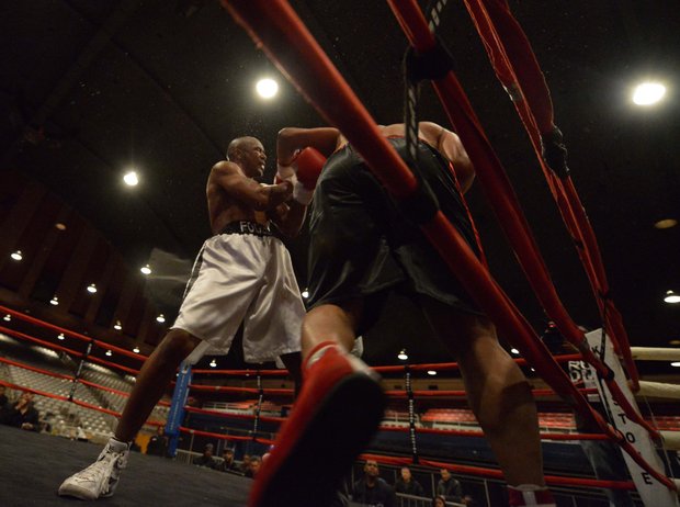 Willis "The Prophet" Lockett (black trunks) faces Julius Fogle in a six-round bout at the D.C. Armory on Friday, Feb. 7. Lockett won by unanimous decision.