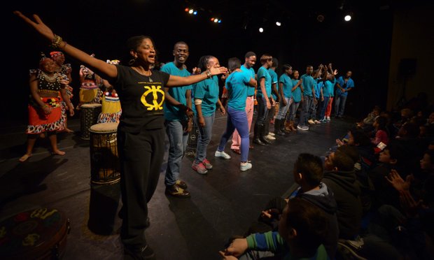 Arla Scott, director of the Taratibu Youth Association, offer remarks after her group performed at Joe's Movement Emporium on Tuesday, February 11.