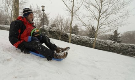 Dave Grimaldi and his son, William, 2, enjoy a sleigh ride at Meridian Hill Park in Northwest on Monday, March 3, after a massive snowstorm hit the region.