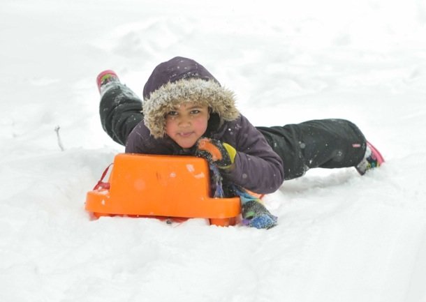 Jahmila AlBanna-Levy, 8, rides a sleigh down a hill at Meridian Hill Park in Northwest D.C. on Monday, March 3, after a massive snowstorm hit the region.