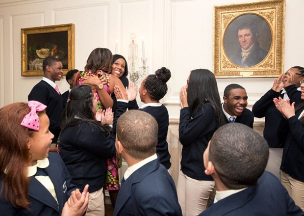 First Lady Michelle Obama greets students from Orchard Gardens in Roxbury after the students performed at a luncheon for National Governors Association spouses in the Map Room of the White House last week.
