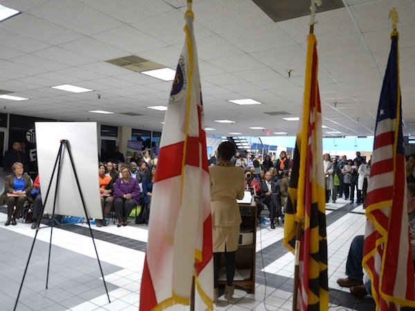 Global Vision Community Health Center founder Toyin Opesanmi speaks during the grand opening of the health center in Capitol Heights, Md., on Thursday, March 6.