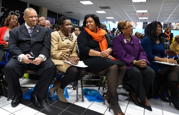 Global Vision Community Health Center founder Toyin Opesanmi (center) shows emotion as Prince George's Council Member Andrea C. Harrison (D-District 5) gives remarks about her during the grand opening of the health center in Capitol Heights, Md., on Thursday, March 6.