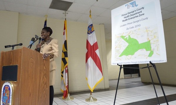 Global Vision Community Health Center founder Toyin Opesanmi speaks during the grand opening of the health center in Capitol Heights, Md., on Thursday, March 6.
