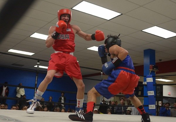 Jalonte Cole (left) of the NoXcuse Gym tries to land a punch against Tommy Avelar of the Sugar Ray Leonard Gym during the third week of the 2014 Washington Golden Gloves Championship Tournament on Saturday, March 8, at the Sugar Ray Leonard Boxing Center in Hyattsville, Md.