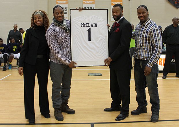 Al McClain’s Hyde Park High School basketball number “1” was officially retired at a ceremony at the Reggie Lewis Center in Roxbury. McClain, picture right in suit, played college basketball at the University of New Hampshire, where he still holds the scoring record. He was later drafted by the Houston Rockets. Also pictured are McClain’s sister Almand and twin brothers Billy and Bobby who are professional dancers known as The Wonder Twins.