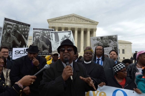 Southern Christian Leadership Conference President Charles Steele Jr. (center) speaks at the base of the U.S. Supreme Court building in D.C. during a rally for voting rights on Wednesday, March 12.