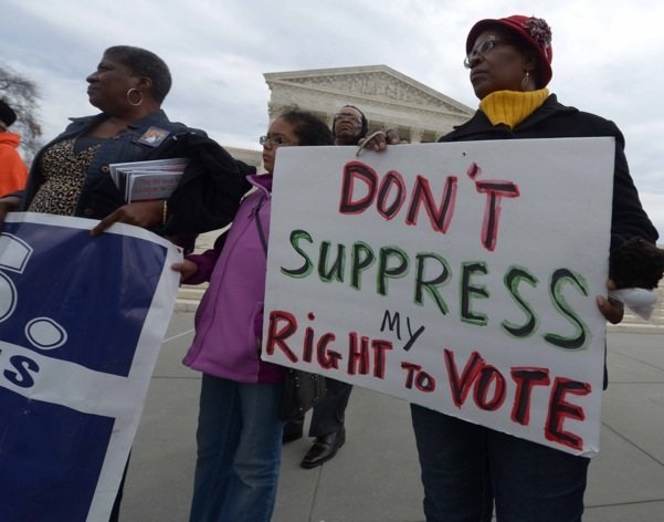 Demonstrators converge at the base of the U.S. Supreme Court building in D.C. during a rally for voting rights Wednesday, March 12.