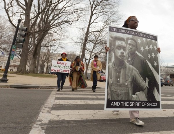 Demonstrators make their way from Union Station to the U.S. Supreme Court building in D.C. during a rally for voting rights Wednesday, March 12.