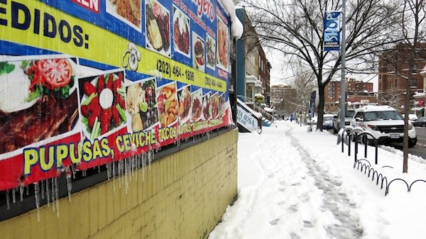 Icicles form on a restaurant banner on Columbia Road in Northwest D.C. on March 17, 2014, after a winter storm hit the region.