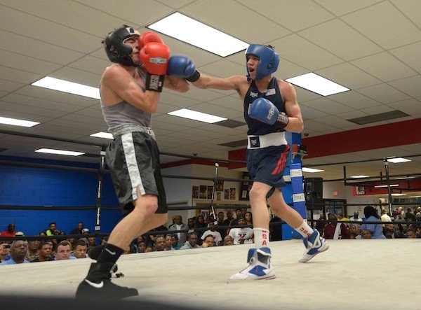 Jalonte Cole (NoExcuse) lands a punch against Andrew Barrett (Laurel Boy and Girls Club) during a semifinals bout in the 2014 Washington Golden Gloves championship tournament at the Sugar Ray Leonard Boxing Center in Palmer Park, Md., on March 15. Cole won the match to advance to the finals.