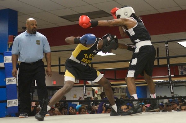 Montell Pridgett (Umar) lands a body blow against Jonathan Ludson (Monsters, Inc.) during a semifinals bout in the 2014 Washington Golden Gloves championship tournament at the Sugar Ray Leonard Boxing Center in Palmer Park, Md., on March 15. Pridgett defeated Ludson and will face Gary Antuanne Russell on March 29 in Waldorf, Md., for the championship.