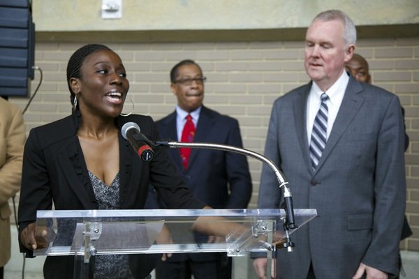 Khady Kamara, Chief Marketing Officer of Arena Stage, introduces D.C. Council Member Tommy Wells at the opening of the D.C. Job Fair on March 28 at the Mead Center for American Theater in Southwest.