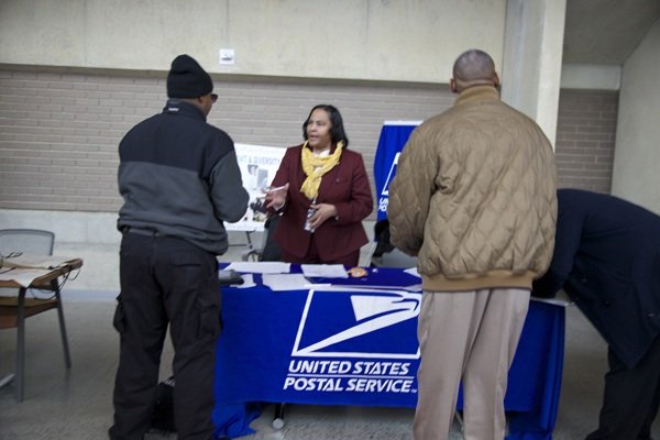 Deborah Evans Atkins, manager of Learning, Development and Diversity, recruits for the U.S. Postal Service during the D.C. Job Fair on March 28 at the Mead Center for American Theater in Southwest.