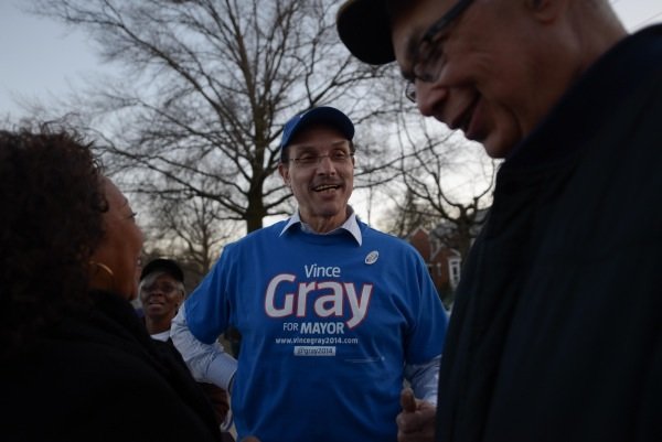 D.C. Mayor Vincent Gray talks with a supporter outside of Polling Precinct 67 at Bunker Hill Elementary School in Northeast on April 1, the day of the city's Democratic primary.