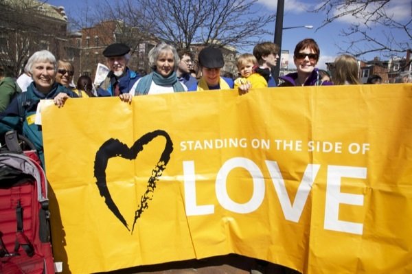 Carol Falk 72, Alan Johnson 73, Kathy Ogle 52, Cathy Rion-Starr 37, Robin Rion-Starr, 1, and Jan Smart, 64, all members of All Souls Church Unitarian in D.C., participate in a rally and march for immigrant rights in Lamont Park in Mount Pleasant on April 5, 2014.