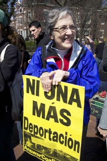 Alice Foltz, 70, holds a poster in D.C.'s Lamont Park in the Mount Pleasant neighborhood in Northwest at a rally for immigrant rights on April 5, 2014.