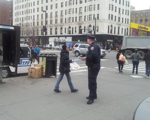 NYPD officers handed out fliers on April 2nd near the notorious intersection of 125th street and Lenox Ave where several ... NYPD officers handed out fliers on April 2nd near the notorious intersection of 125th street and Lenox Ave where several ...