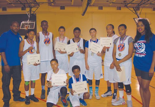 Winners of the Portland Observer’s Joyce Washington Classic boys tournament pose for a picture after the game. Portland Impact trumped over the North Starz, 58-45.