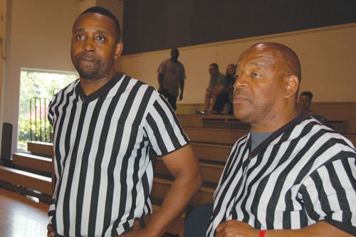 Referees Jeremiah Dalton (left) and Tony Jacobs check out the 2014 Portland Observer Joyce Washington Classic teams.
