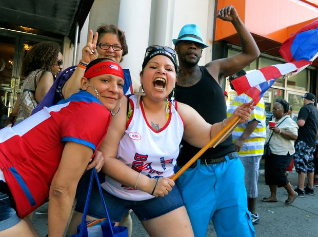 Luisaira Lerrano, holding the flag, with friends.