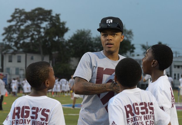 Rapper Bow Wow was one of many stars on the field during Robert Griffin III's first-ever "Friday Night Lights" football camp at Anacostia Senior High on Friday, June 13.