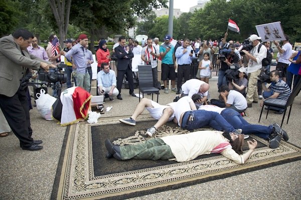 Iraqis depict an act of terrorism in front of the White House on June 21 during a demonstration against new military action in Iraq.