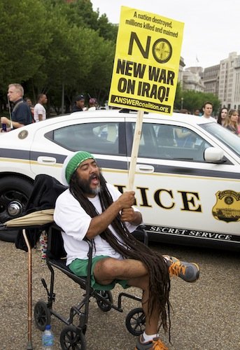 A man participates in a demonstration against new military action in Iraq on June 21 in front of the White House.
