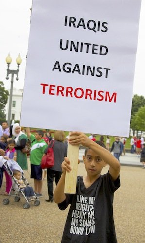 Munther Himmad, 9, holds a sign in front of the White House on June 21 during a demonstration against new military action in Iraq.