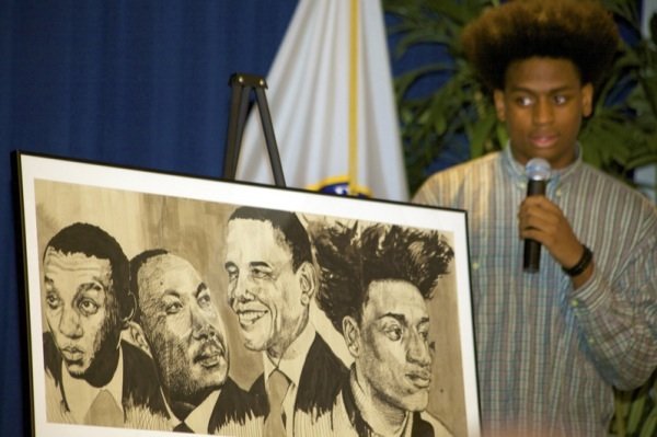 Alfred Dudley III, NAACP ACT-SO winner, describes his ink drawing "Black Rushmore" during a June 2 ceremony at a U.S. Department of Education facility in Richmond, Virginia, to commemorate the 50th anniversary of the Civil Rights Act.