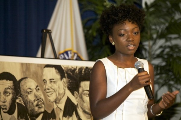 Blossom Ojukwu, NAACP ACT-SO winner, sings "We Shall Overcome" during a June 2 ceremony at a U.S. Department of Education facility in Richmond, Virginia, to commemorate the 50th anniversary of the Civil Rights Act.