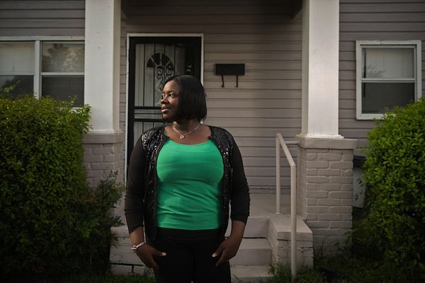 Evonna Lucas stands for a portrait outside of her home on in south Greenwood. Lucas graduated from Mississippi Valley State University last year, but said that well-paying jobs for educated young people are hard to find in her hometown. (Edmund D. Fountain, special to ProPublica)