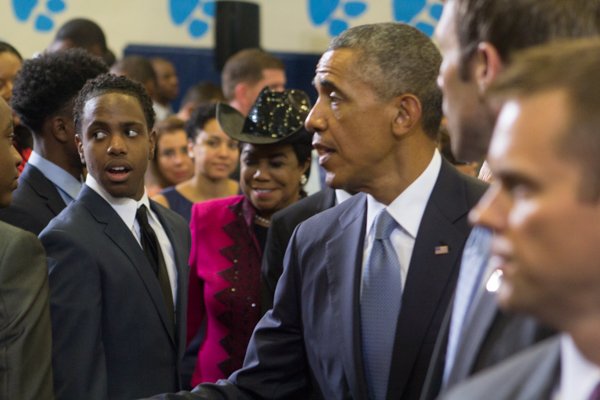 President Obama greets some of the young men attending the town hall for the White House's "My Brother's Keeper" initiative after his speech. Rep. Frederica Wilson (D-FL) in the background also attended the event held at Walker Jones Education Center on Monday, July 21.